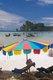 Thailand: Beach umbrella, boats and karst formations at Ao Lo Dalum, Ko Phi Phi Don, Ko Phi Phi